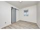 Bedroom featuring updated flooring, closet, and a window for natural light at 2021 Reformers Ave, Indianapolis, IN 46203