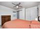 Bedroom featuring a ceiling fan, updated flooring, and access to closet at 2021 Reformers Ave, Indianapolis, IN 46203