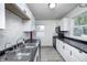Well-lit kitchen with ample countertop space, modern appliances, and updated cabinetry throughout at 2021 Reformers Ave, Indianapolis, IN 46203