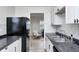 Efficient kitchen space featuring modern appliances, sleek countertops, and white shaker style cabinets at 2021 Reformers Ave, Indianapolis, IN 46203