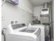 This laundry room features washer, dryer, and built-in shelving at 2021 Reformers Ave, Indianapolis, IN 46203