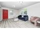 Inviting living space featuring a comfortable sofa, stylish seating, and ample natural light at 2021 Reformers Ave, Indianapolis, IN 46203