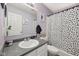 Cozy bathroom with a classic sink, mirror, and a decorative black and white polka dot shower curtain at 2116 Crimson Ln, Lebanon, IN 46052