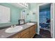 Bathroom featuring a double vanity, large mirror, and whimsical shower curtain at 2116 Crimson Ln, Lebanon, IN 46052
