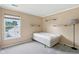 Cozy bedroom with a plush carpet, neutral walls, and a large window offering natural light at 2116 Crimson Ln, Lebanon, IN 46052