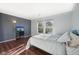 Cozy bedroom with natural light, a TV, and dark wood floors at 2116 Crimson Ln, Lebanon, IN 46052