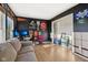 Bright bedroom with light hardwood floors, sports decorations, and ample closet space at 2116 Crimson Ln, Lebanon, IN 46052