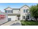 Charming two-story home with a well-manicured lawn, attached garage, and a welcoming front entrance at 2116 Crimson Ln, Lebanon, IN 46052