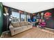 Inviting living room with natural light, comfortable couch, and sports memorabilia at 2116 Crimson Ln, Lebanon, IN 46052