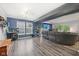 Living room featuring a flat screen TV, modern lights, wood floors, and an open concept layout at 2116 Crimson Ln, Lebanon, IN 46052