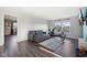 Open concept living space with neutral decor, workout equipment, and hardwood-style flooring at 2116 Crimson Ln, Lebanon, IN 46052
