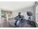 Bright living space with workout equipment and comfortable seating, featuring hardwood-style flooring at 2116 Crimson Ln, Lebanon, IN 46052
