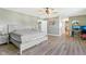 Spacious main bedroom with modern decor, laminate floors, and en-suite bathroom access at 2116 Crimson Ln, Lebanon, IN 46052