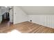 Finished attic bedroom with hardwood floors and an attached room at 2221 Douglas Rd, Indianapolis, IN 46220