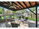 A well-maintained outdoor back porch featuring a backyard view and a ceiling fan at 2221 Douglas Rd, Indianapolis, IN 46220