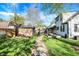 Spacious backyard featuring a garden shed, stepping stone walkway, and lush green lawn at 2221 Douglas Rd, Indianapolis, IN 46220