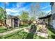 Large backyard with a garden shed, wooden fence, raised garden beds, and a stepping stone path at 2221 Douglas Rd, Indianapolis, IN 46220