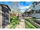 Well-maintained backyard featuring a shed, lush lawn, patio, and landscaped garden beds perfect for outdoor enjoyment at 2221 Douglas Rd, Indianapolis, IN 46220