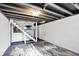 Unfinished basement featuring concrete walls and floors at 2221 Douglas Rd, Indianapolis, IN 46220
