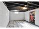 Unfinished basement featuring concrete walls and floors at 2221 Douglas Rd, Indianapolis, IN 46220