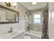 Full bathroom featuring a shower/tub combo, vanity and ample lighting at 2221 Douglas Rd, Indianapolis, IN 46220