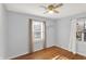 Bedroom with neutral walls, hardwood floors, and natural light through windows at 2221 Douglas Rd, Indianapolis, IN 46220