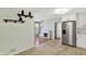 Open-concept kitchen featuring stainless steel appliances, stylish cabinets and tiled floor at 2221 Douglas Rd, Indianapolis, IN 46220