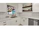 Bright updated kitchen with white subway tile backsplash, stainless appliances, and quartz counters at 2221 Douglas Rd, Indianapolis, IN 46220