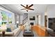 Stylish living room featuring hardwood floors, comfortable seating, and a modern fireplace at 2221 Douglas Rd, Indianapolis, IN 46220