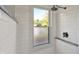 Bright shower with white subway tile and a rain shower head at 2221 Douglas Rd, Indianapolis, IN 46220