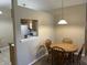 Cozy dining area with pass through to the kitchen at 2324 Harvest Moon Dr, Indianapolis, IN 46229