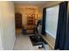 Office featuring a desk, shelves, exercise equipment and plenty of natural light at 2324 Harvest Moon Dr, Indianapolis, IN 46229