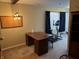 Home office setup with desk, chair, fitness equipment, and overhead lighting at 2324 Harvest Moon Dr, Indianapolis, IN 46229