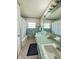 Charming bathroom featuring dual sinks, a large mirror and vintage wallpaper at 2350 Brewer Dr, Indianapolis, IN 46227