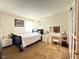 Sunlit bedroom showcasing neutral decor and plush carpeting, creating a serene retreat at 2350 Brewer Dr, Indianapolis, IN 46227