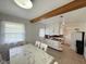 Bright dining room adjacent to kitchen, featuring a marble table and wood flooring at 2350 Brewer Dr, Indianapolis, IN 46227