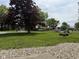Expansive front yard featuring a beautiful, mature tree and well-maintained lawn at 2350 Brewer Dr, Indianapolis, IN 46227