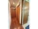 Hallway with wood floors and multiple doorways at 2350 Brewer Dr, Indianapolis, IN 46227