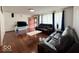 Comfortable living room with rich hardwood floors, sofa set and decor at 2350 Brewer Dr, Indianapolis, IN 46227