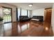 Inviting living room with hardwood floors, neutral walls, and comfortable black leather seating at 2350 Brewer Dr, Indianapolis, IN 46227