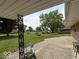 View from the covered patio, overlooking the spacious front yard and neighborhood at 2350 Brewer Dr, Indianapolis, IN 46227