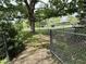 Backyard featuring a chain-link fence and mature tree, offering shade and privacy at 2350 Brewer Dr, Indianapolis, IN 46227