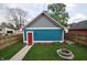 Exterior view of a vibrant backyard with a charming fire pit and well-maintained lawn at 2363 N Pennsylvania St, Indianapolis, IN 46205