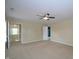 Large bedroom with ceiling fan, neutral walls and carpet, and access to ensuite bathroom at 2363 N Pennsylvania St, Indianapolis, IN 46205
