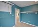 Walk-in closet featuring custom shelving and ample storage space, with door opening to bedroom at 2363 N Pennsylvania St, Indianapolis, IN 46205