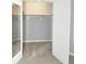 Walk-in closet featuring custom shelving and ample storage space at 2363 N Pennsylvania St, Indianapolis, IN 46205