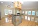 Open-concept kitchen with hardwood floors, dining area, and view into the living space at 2363 N Pennsylvania St, Indianapolis, IN 46205