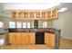 This kitchen features wooden cabinets, stainless steel appliances and mosaic backsplash at 2363 N Pennsylvania St, Indianapolis, IN 46205