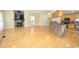 Spacious living room with hardwood floors, stone fireplace, and open kitchen access at 2363 N Pennsylvania St, Indianapolis, IN 46205