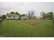 Expansive backyard with a fenced garden area and lush greenery at 2657 Mars Hill St, Indianapolis, IN 46241